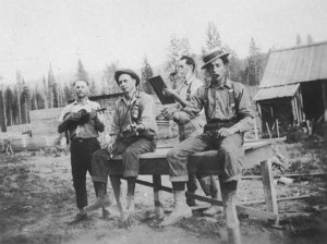 Music in the camp.  Jeffery and Ansgar with violins Thoralf holding a book? and Frank