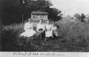 Sophie, second from the left, with some girls in front of the smokehouse
